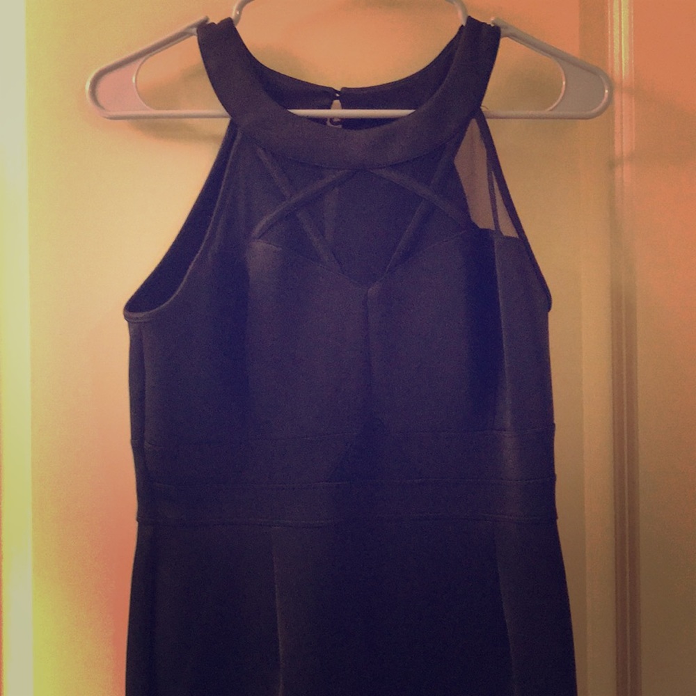 Black fitted dress. Knee high.